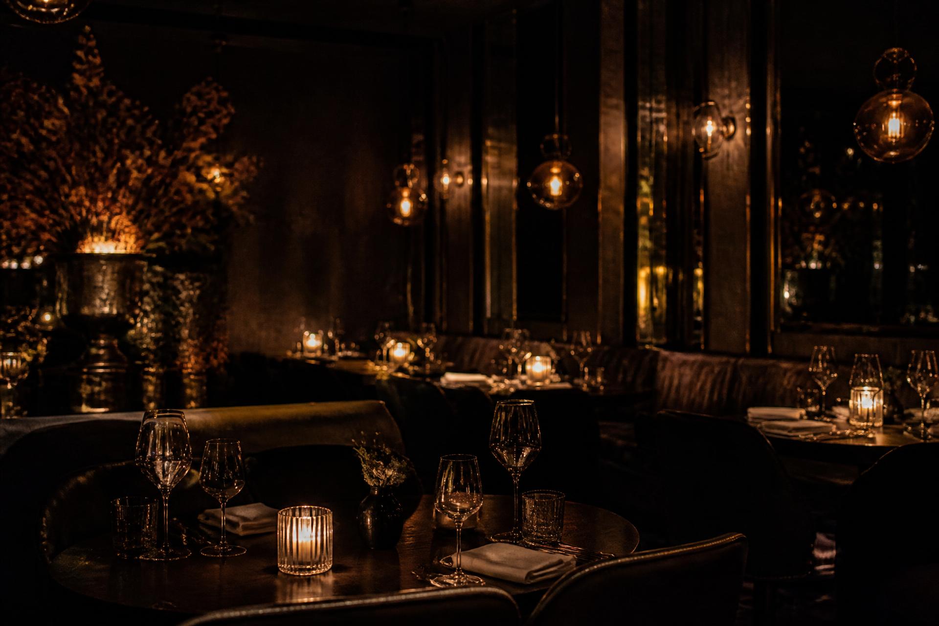 Candlelit dining room at Maison Noir